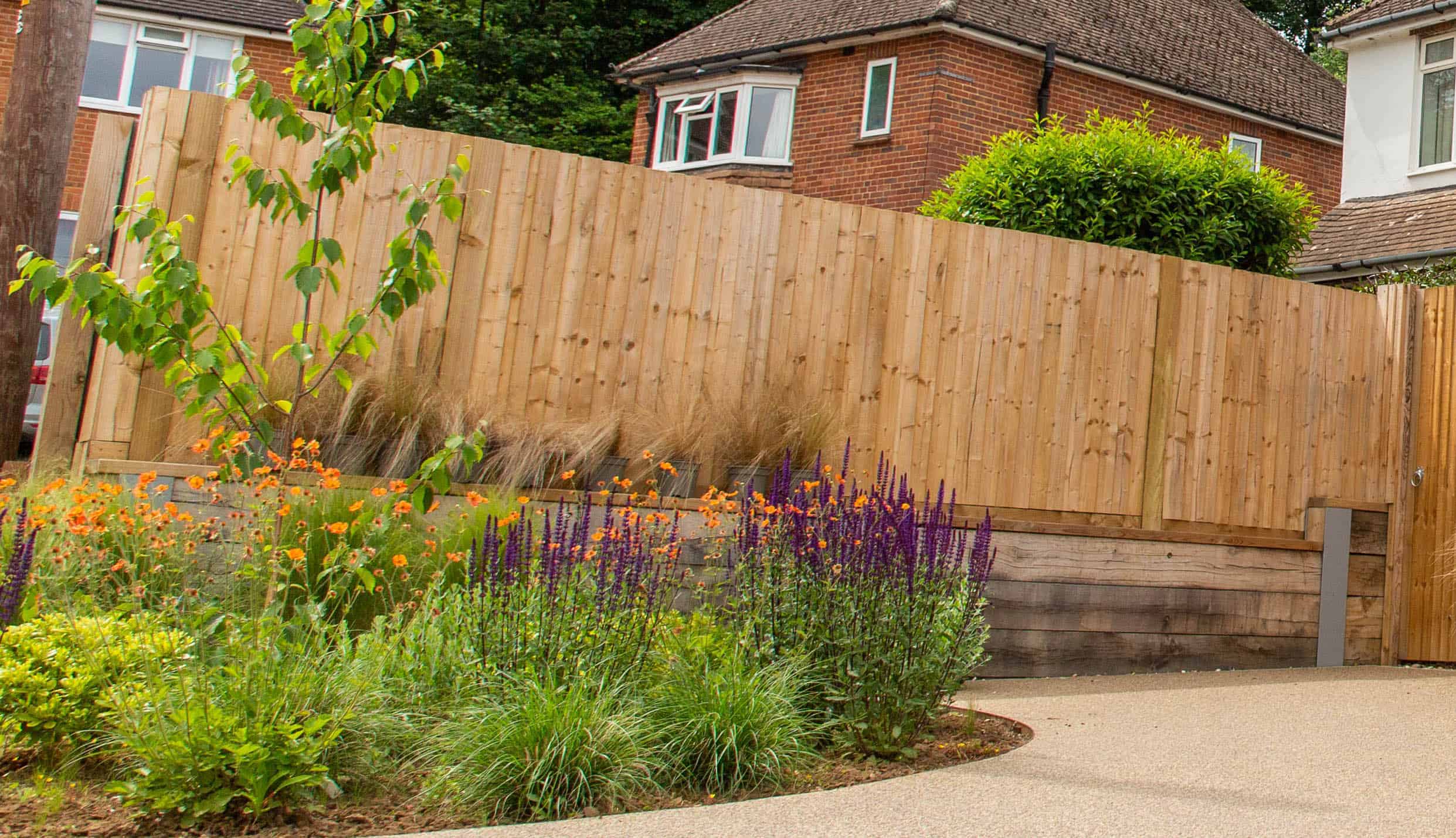 garden fence installation showing wood fencing