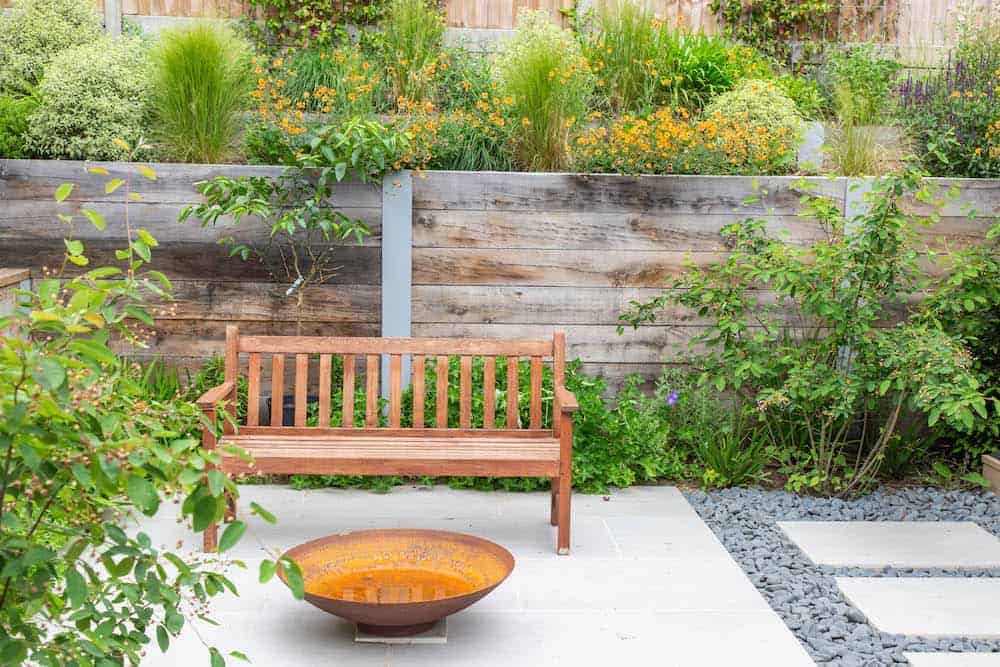landscaping company guildford showing bench in modern garden